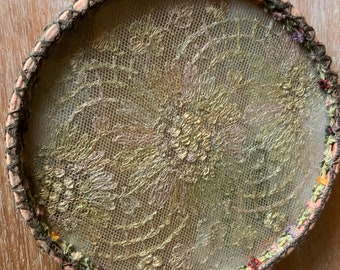 Vintage tattering underneath a piece of glass