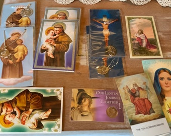 Group of religious prayers, saints, and medals