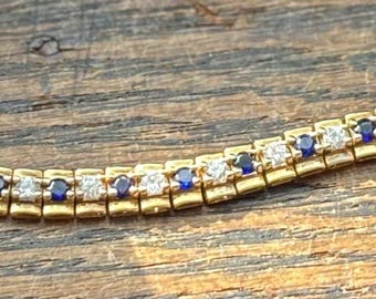 Vermeil over Sterling silver sapphire and glass stones. 1980’s stamped