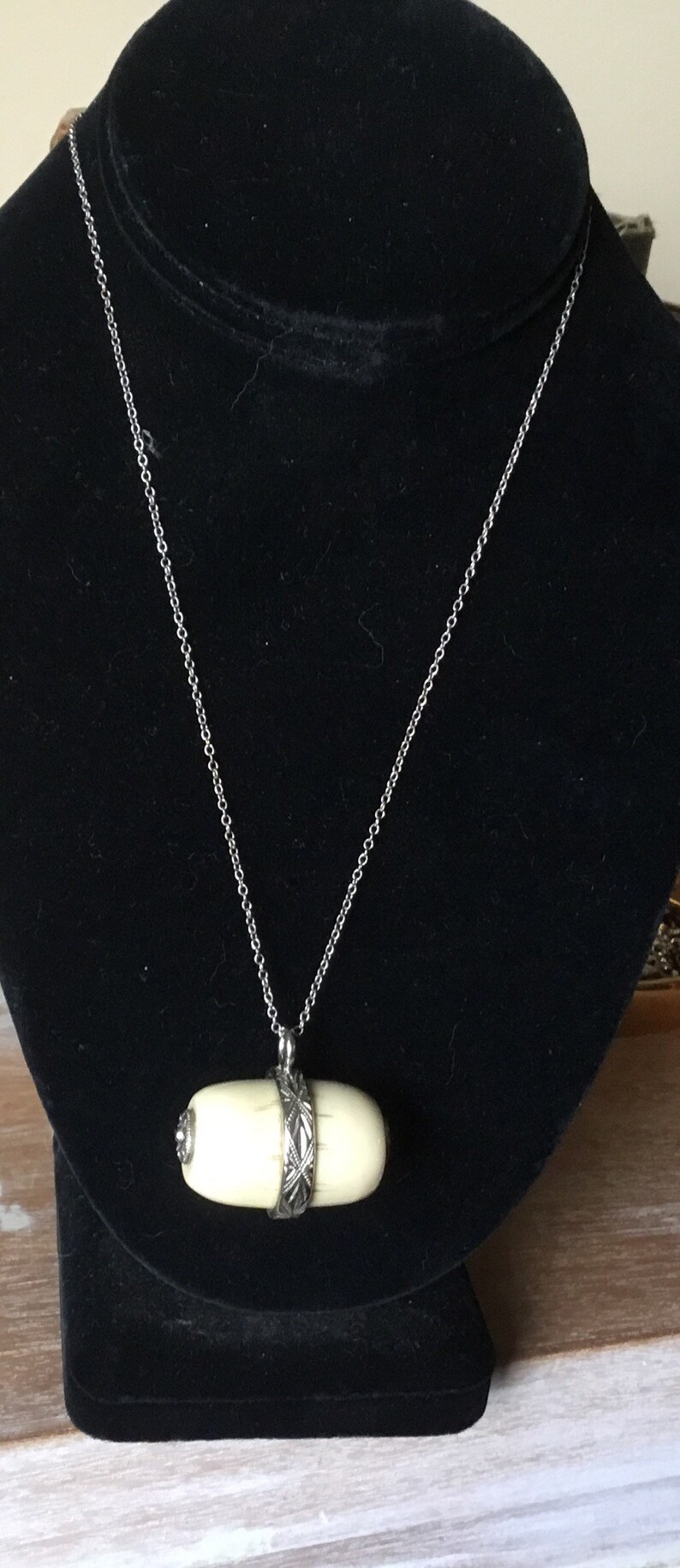 Asian bone pendant necklace.