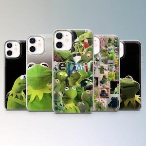 May include: A selection of phone cases showcasing Kermit the Frog. The cases display different images of Kermit, including close-ups and collages. The cases are clear with a black border.