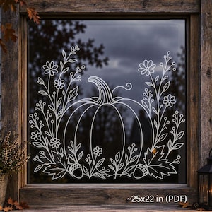 May include: A white line art decal applied to a window, featuring a central pumpkin surrounded by floral stems, leaves, and two acorns. The text "~25x22 in (PDF)" is visible at the bottom, and "Print for glass" is near the lantern.