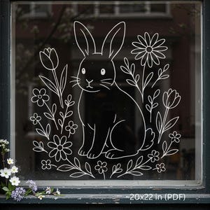 May include: A black and white window decal featuring a rabbit design with floral elements. The image includes a rabbit surrounded by flowers and foliage, with the text "~20x22 in (PDF)" at the bottom. The design measures approximately 51x56 cm.