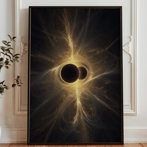 May include: Framed art print featuring a digital abstract design. The artwork showcases two dark orbs surrounded by swirling golden light against a black background. The print is displayed in a black frame.