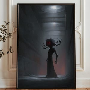 May include: A framed art print depicting a dark, surreal figure with a box-shaped head and branch-like antlers. The figure stands in a dimly lit, tunnel-like space with a red glowing eye. The artwork is predominantly dark gray and black.