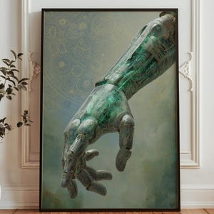 May include: Framed art print showing a detailed depiction of a robotic hand emerging from a soft, ethereal background. The hand is rendered in shades of green and bronze, with intricate mechanical details. The artwork is framed in a black border.