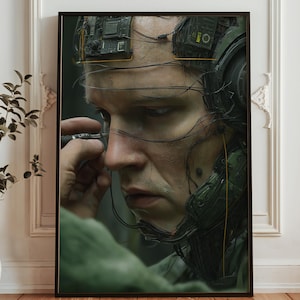 May include: A framed digital art print featuring a close-up of a person with cybernetic implants and wiring. The person is holding a tool near their face. The artwork has a futuristic, sci-fi theme with a muted color palette.