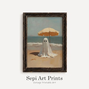 May include: A framed wall art print featuring a white ghost figure standing on a sandy beach under a yellow beach umbrella, with the ocean and sky in the background. The text Sepi Art Prints Vintage Printable Art is printed below the frame.