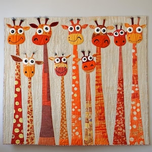 May include: A whimsical quilt featuring a group of giraffe appliqués. The giraffes have orange, red, and yellow patterned necks and faces with large, expressive eyes. The background is a neutral beige color, and the quilt has a quilted texture.