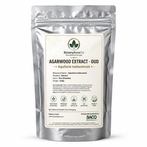 May include: A silver stand-up pouch containing Agarwood Extract - Oud powder. The label features the BotanyAuraCo logo, botanical name Aquilaria malaccensis, origin India, and icons for 100% pure, premium quality, steam distilled, no additives, and cruelty free.
