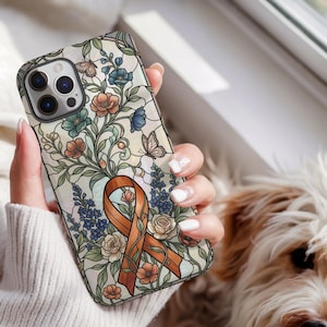 May include: A smartphone case featuring a stained glass style design with an orange awareness ribbon at the center, surrounded by intricate illustrations of blue, peach, and white flowers, green foliage, and small butterflies on a light background.