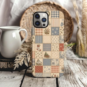 May include: A smartphone case featuring a patchwork design with various holiday-themed squares. Patterns include blue and white buffalo check, red and white plaid, snowflakes, pine branches, a stocking, a birdhouse, and a sled with a tree.