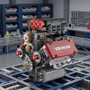 May include: A V8 engine model constructed from plastic building blocks. The engine features a red transparent valve cover with the text V8 ENGINE, a black air intake with the word ONE, and various silver, gold, and black gears and mechanical parts.