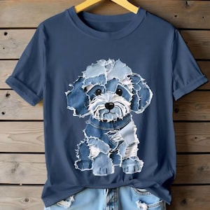 May include: A navy blue t-shirt with a dog design made from denim patches. The dog has a white face and blue denim patches for its fur. The shirt has short sleeves and is paired with light blue denim shorts.