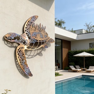 May include: A bronze-coloured metal wall sculpture of a sea turtle, mounted on a light-coloured wall. The artwork features detailed cut-out patterns and a mix of bronze, blue, and purple hues. The turtle is depicted in a flying pose, adding a dynamic element.
