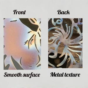 May include: Metal wall art with a floral design. The front has a smooth, iridescent finish, while the back reveals a textured metal surface. The image is labeled "Front" and "Back", with the text "Smooth surface" and "Metal texture".