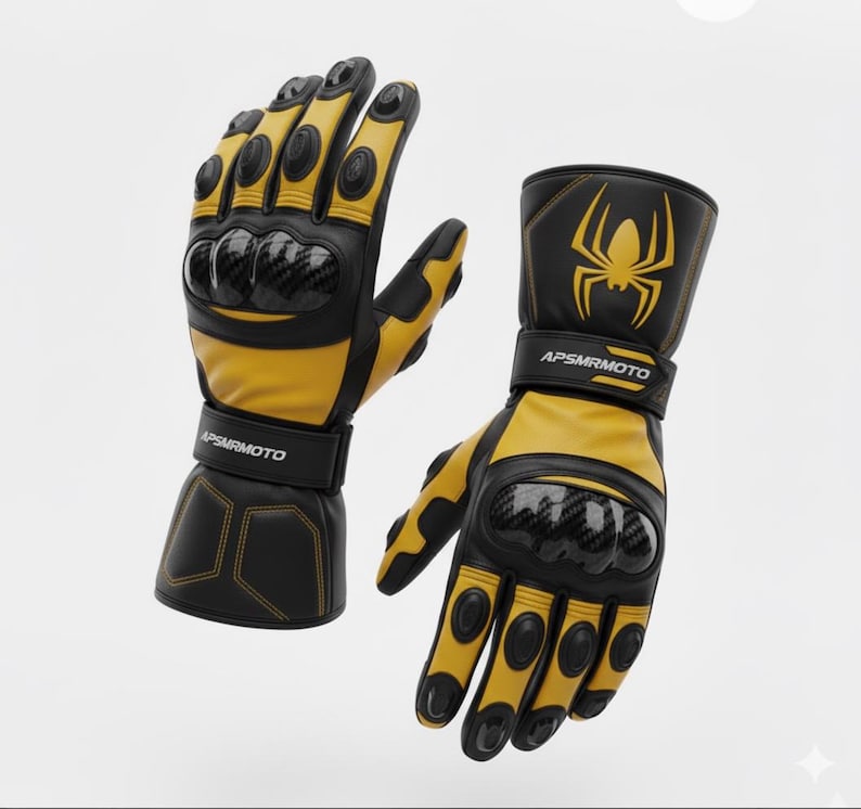 May include: A pair of black and yellow motorcycle gloves. The gloves have carbon fiber knuckle protectors and a spider graphic on the cuff. The brand name APSMRMOTO is printed on the wrist strap.