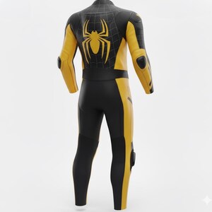 May include: A black and yellow full-body suit with a spider emblem on the back. The suit features yellow accents on the arms, legs, and sides, with black panels and padding. The suit has a sleek, form-fitting design.