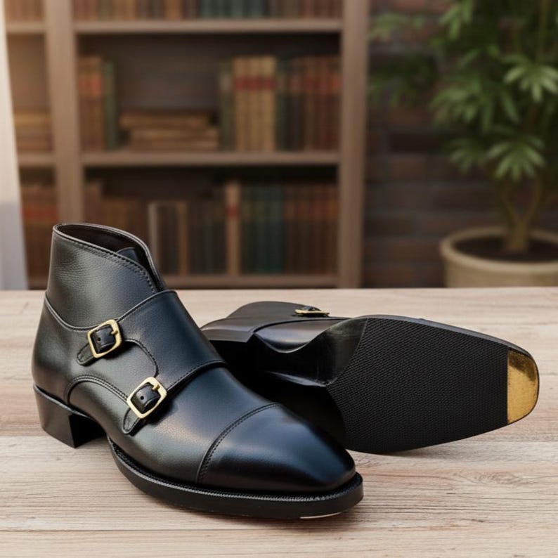 Handmade black leather double buckle monk strap shoes for men with classic formal design and metal buckle closure