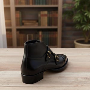 Handmade black leather double buckle monk strap shoes for men with classic formal design and metal buckle closure