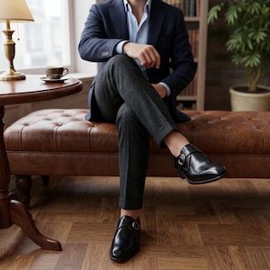 Handmade black leather single buckle monk strap shoes for men with classic formal design and metal buckle closure