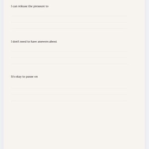 May include: A cream-colored journal page with the title "Things I don't need to carry right now." The page includes prompts: "I can release the pressure to," "I don't need to have answers about," and "It's okay to pause on," with lines for writing.