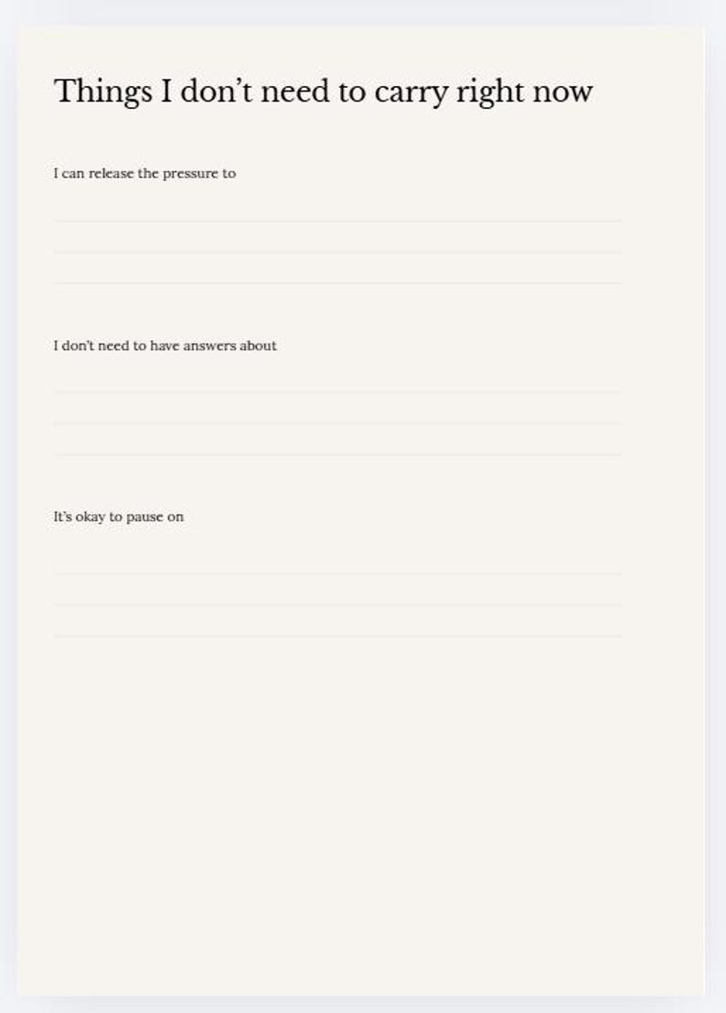 May include: A cream-colored journal page with the title "Things I don't need to carry right now." The page includes prompts: "I can release the pressure to," "I don't need to have answers about," and "It's okay to pause on," with lines for writing.