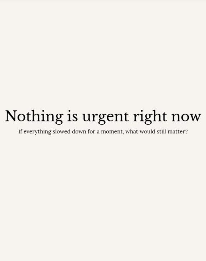 May include: A minimalist design with the text "Nothing is urgent right now" in a serif font. Below, smaller text reads, "If everything slowed down for a moment, what would still matter?" The background is a solid, off-white color.