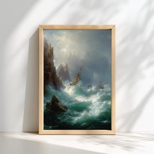 May include: A framed nautical painting depicts a stormy sea with crashing waves and a ship in distress. The artwork features a dramatic sky, rocky cliffs, and a palette of blues, greens, and whites. The wooden frame adds a classic touch.