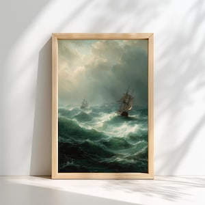May include: A framed print of a seascape painting showing two sailing ships navigating rough seas under a stormy sky. The artwork uses shades of green, blue, and white, with a wooden frame.