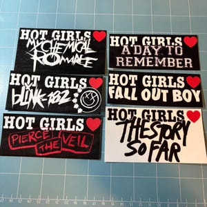 May include: Six rectangular stickers featuring the text HOT GIRLS and a red heart icon. The stickers display band names including My Chemical Romance, A Day To Remember, Blink-182, Fall Out Boy, Pierce The Veil, and The Story So Far in black or white.