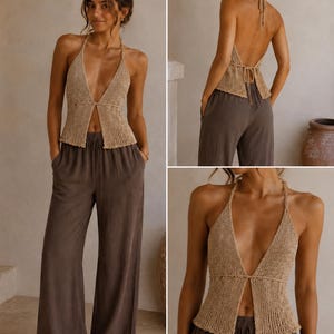 May include: A beige halter top with a deep V-neck and matching brown wide-leg pants. The top is knit and has a tie closure in the back. The pants are a solid color and have a relaxed fit. The outfit is suitable for warm weather.