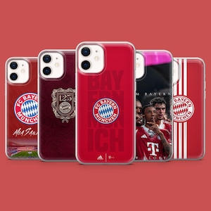 May include: A selection of red and white phone cases showcasing the FC Bayern Munich logo and team imagery. The cases feature the team's emblem, player photos, and the text "FC Bayern München".
