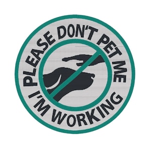 May include: A circular embroidered patch with a light grey background and a teal border. It features a black silhouette of a dog head and a human hand reaching toward it, crossed out by a teal diagonal line. The text reads PLEASE DON'T PET ME I'M WORKING.
