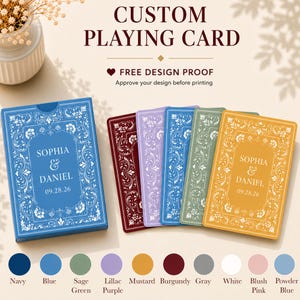 May include: Custom playing cards featuring a blue box and four cards in burgundy, lilac, blue, and mustard. Each card displays the text SOPHIA & DANIEL 09.28.26 within a white ornate floral border. A color palette chart is shown below.