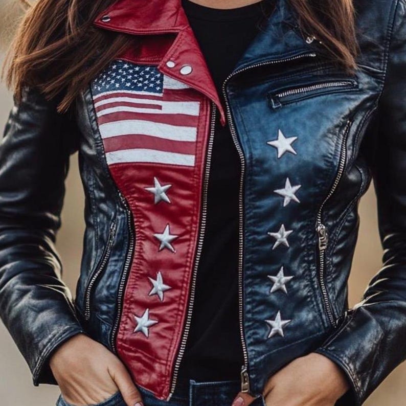 May include: A navy blue and red leather jacket with an American flag design on the front. The jacket features white stars and a zipper closure. The collar is red, and the sleeves are navy blue.