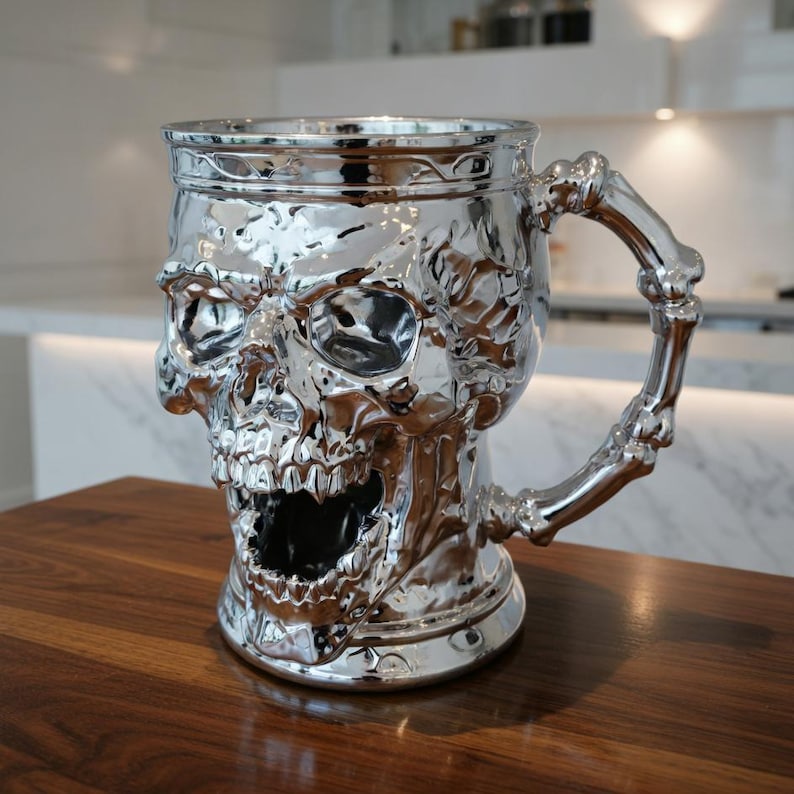 A professional collage showcasing over 20 unique 3D printable STL models for beer mugs and can holders. The image features high-detail designs including a horned Minotaur with gold accents, a gothic skull wearing aviator goggles, and a steampunk gas mask style tankard with copper pipes. The background displays various mythical, viking, and dark fantasy themed mugs in metallic silver and bronze finishes. Large yellow and blue 3D text in the center reads '20+ Can Holder & Beer Mug STL'.