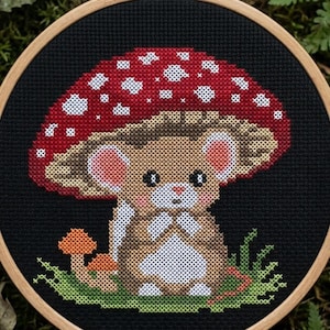 May include: A set of three ceramic mugs with a speckled, matte finish. The mugs are in shades of cream, light gray, and dark gray. Each mug has a simple, minimalist design, perfect for coffee or tea.