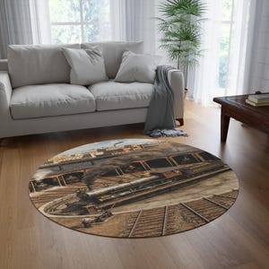 May include: A round area rug featuring a detailed illustration of a vintage steam locomotive positioned on a railway turntable. The train is dark in color with metallic accents, emitting smoke, and is set against a backdrop of a train depot.