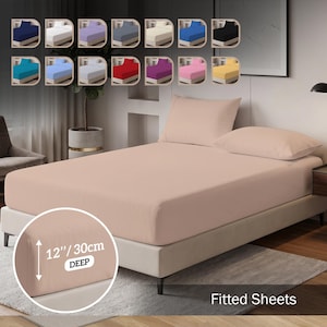 May include: A light peach fitted sheet on a bed with two matching pillowcases. A circular inset shows the sheet has a 30 cm deep pocket. A colour palette above displays fourteen additional solid colour options for the fitted sheet product.