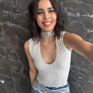 Close-up of lace texture and mirror detail on choker