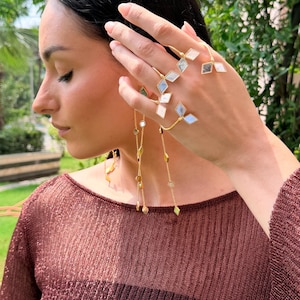Artistic brass finger and palm cuff
Fashionable festival hand jewelry piece