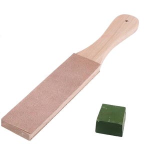 May include: A wooden leather strop with a light brown textured surface and a handle featuring a small hole at the end, accompanied by a small, rectangular block of solid green polishing compound used for sharpening blades and tools.
