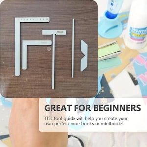 May include: A set of silver metal bookbinding alignment tools including an L-shaped ruler with 10 cm markings, a T-shaped guide labelled 15MM, a straight edge, and a corner guide. The tools are arranged on a dark wood surface with text Great for beginners.