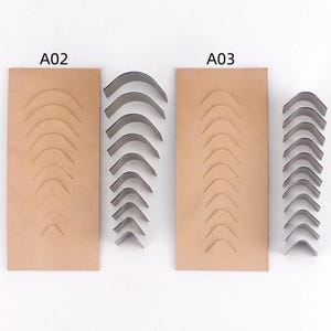 May include: Two sets of leather craft cutting dies labeled A02 and A03. Each set includes a rectangular tan leather piece with multiple arched slits and a corresponding stack of curved metal blades in graduated sizes for precise leather cutting.