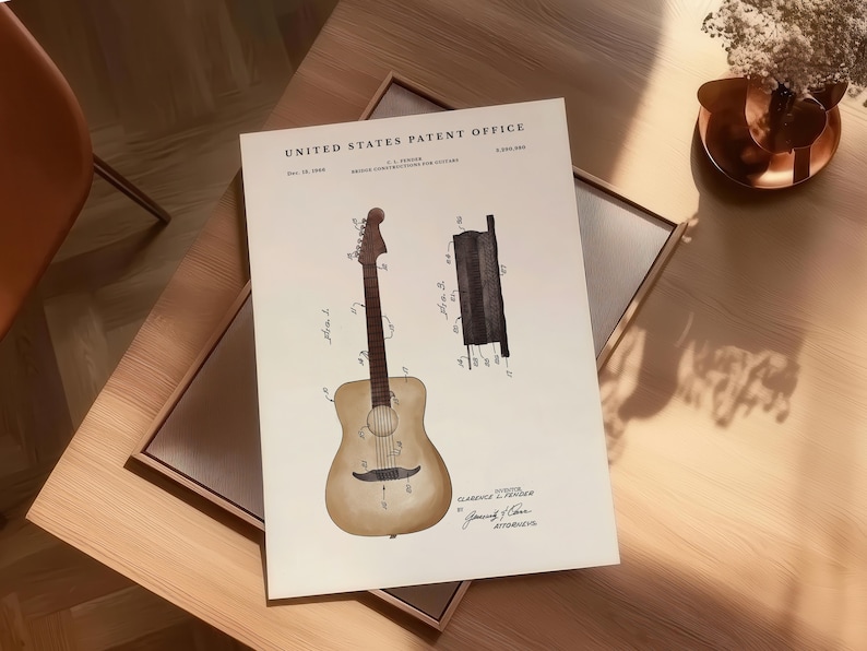 May include: A vintage-style print of a guitar patent from the United States Patent Office. The print features detailed illustrations of a guitar and its components, with text including the inventor's name and patent information. The print is on a cream-colored background.