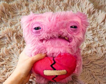 Pink Fuggler Plush – Wide Eyed Weirdo, Ugly Tooth Doll, Broken Heart Toy