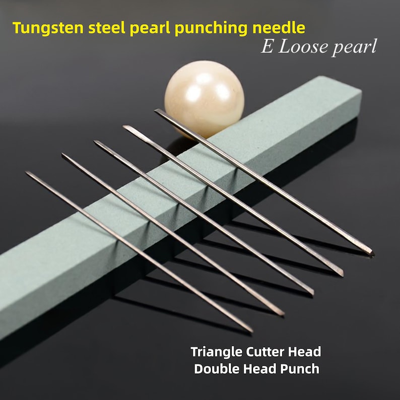May include: Set of seven tungsten steel pearl punching needles with triangle cutter heads. The needles are arranged on a gray rectangular surface with a white pearl next to them. The text "E Loose pearl" and "Triangle Cutter Head Double Head Punch" are visible in the image.