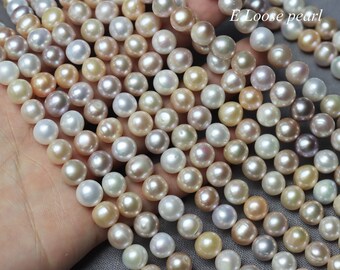 May include: A strand of loose pearls in various shades of white, pink, and cream. The pearls are round and smooth, and they are arranged in a loose, flowing pattern. The text "E Loose pearl" is visible in the image.