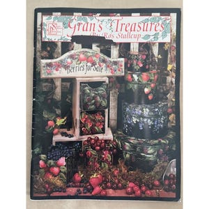 May include: A softcover instructional book titled Gran's Treasures by Ros Stallcup featuring a cover illustration of a wooden display stand and stacked round containers painted with various berries including strawberries, blueberries, and cherries.